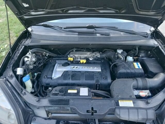 Черный Хендай Туксон, объемом двигателя 2 л и пробегом 192 тыс. км за 7950 $, фото 19 на Automoto.ua