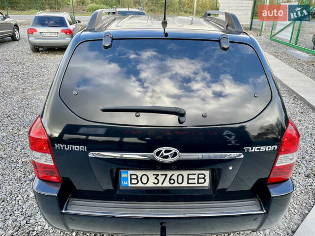 Черный Хендай Туксон, объемом двигателя 2 л и пробегом 224 тыс. км за 7750 $, фото 8 на Automoto.ua