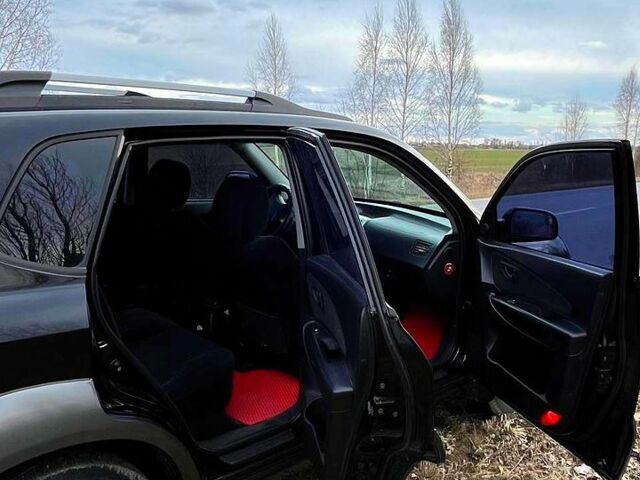Черный Хендай Туксон, объемом двигателя 20 л и пробегом 300 тыс. км за 7500 $, фото 5 на Automoto.ua