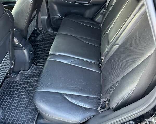 Черный Хендай Туксон, объемом двигателя 1.99 л и пробегом 231 тыс. км за 8500 $, фото 2 на Automoto.ua