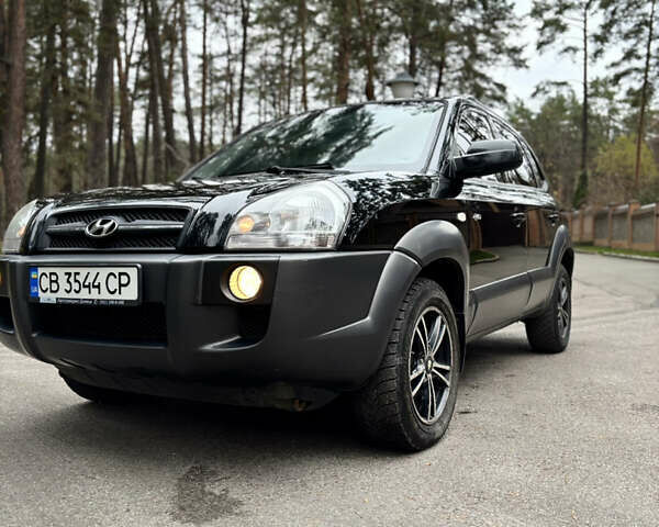 Черный Хендай Туксон, объемом двигателя 1.99 л и пробегом 266 тыс. км за 7500 $, фото 23 на Automoto.ua