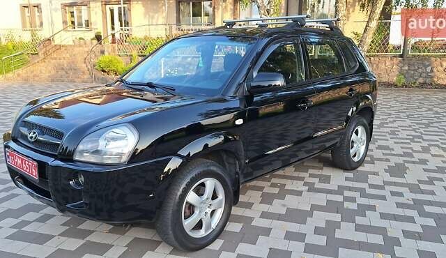 Черный Хендай Туксон, объемом двигателя 2 л и пробегом 190 тыс. км за 8150 $, фото 1 на Automoto.ua