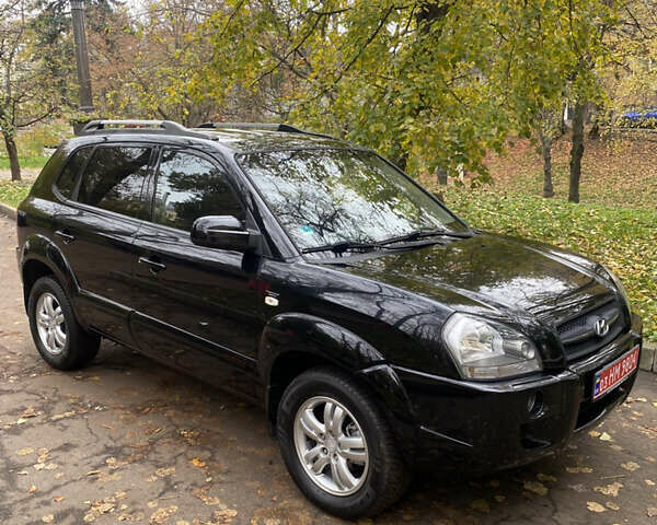 Черный Хендай Туксон, объемом двигателя 2 л и пробегом 178 тыс. км за 7860 $, фото 3 на Automoto.ua