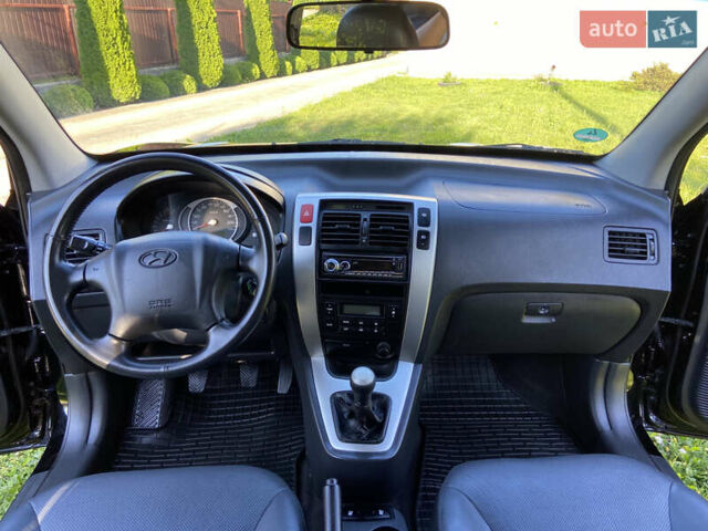 Черный Хендай Туксон, объемом двигателя 1.98 л и пробегом 197 тыс. км за 8000 $, фото 34 на Automoto.ua