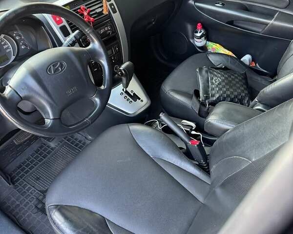 Черный Хендай Туксон, объемом двигателя 1.99 л и пробегом 231 тыс. км за 8500 $, фото 1 на Automoto.ua