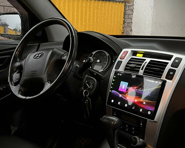 Черный Хендай Туксон, объемом двигателя 2 л и пробегом 151 тыс. км за 9100 $, фото 19 на Automoto.ua