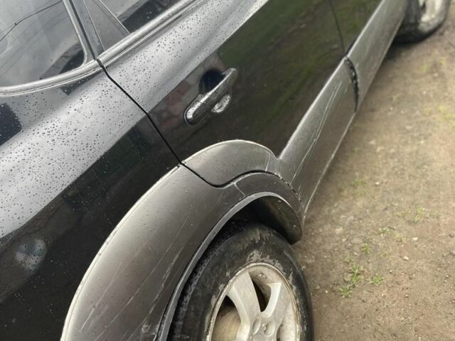 Чорний Хендай Туксон, об'ємом двигуна 2 л та пробігом 230 тис. км за 5999 $, фото 4 на Automoto.ua