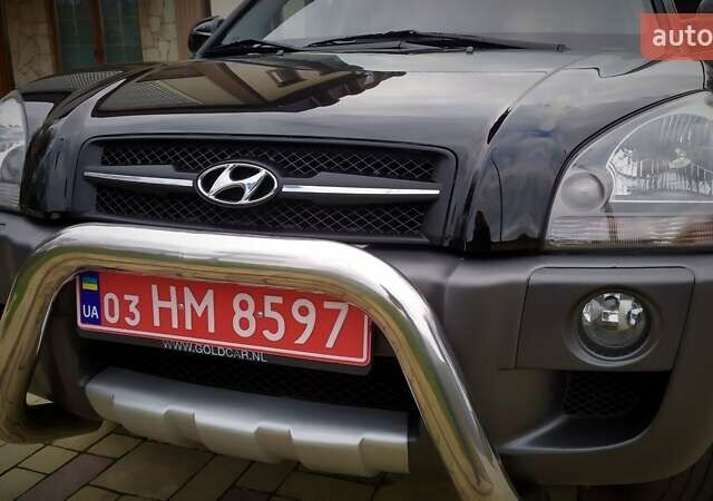 Чорний Хендай Туксон, об'ємом двигуна 2 л та пробігом 229 тис. км за 8600 $, фото 60 на Automoto.ua