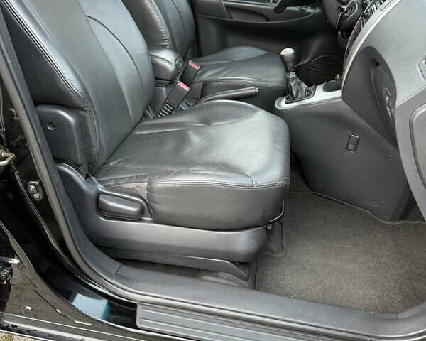 Черный Хендай Туксон, объемом двигателя 1.98 л и пробегом 159 тыс. км за 7600 $, фото 18 на Automoto.ua