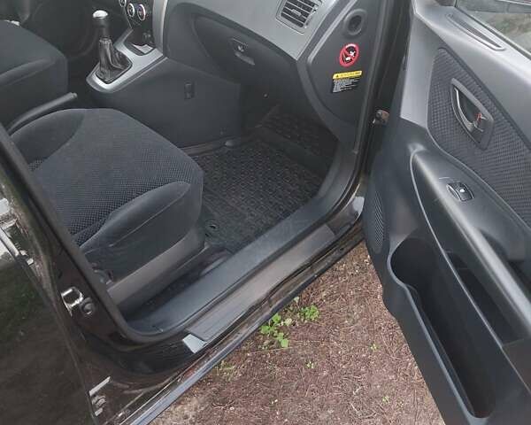 Черный Хендай Туксон, объемом двигателя 1.98 л и пробегом 200 тыс. км за 7100 $, фото 10 на Automoto.ua