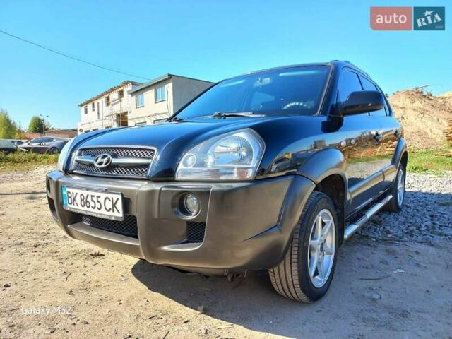 Черный Хендай Туксон, объемом двигателя 2 л и пробегом 219 тыс. км за 8500 $, фото 8 на Automoto.ua