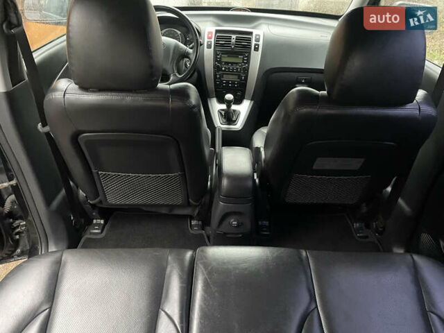 Черный Хендай Туксон, объемом двигателя 2 л и пробегом 180 тыс. км за 7700 $, фото 27 на Automoto.ua