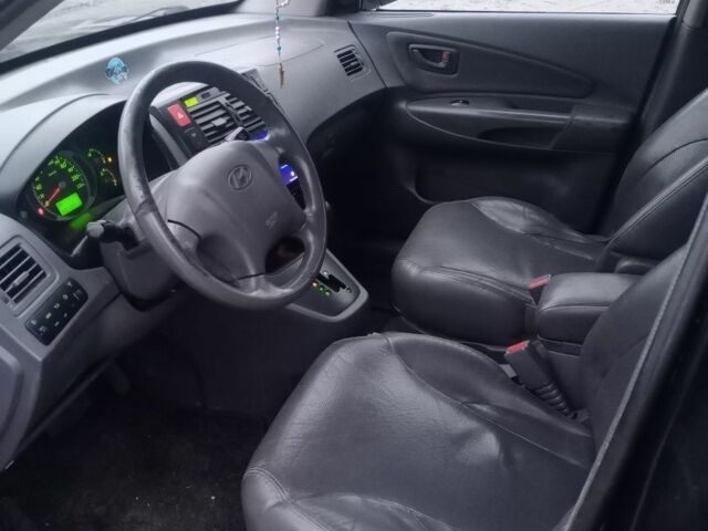 Черный Хендай Туксон, объемом двигателя 2 л и пробегом 280 тыс. км за 3500 $, фото 7 на Automoto.ua