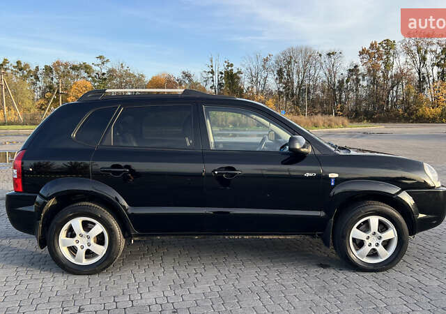 Черный Хендай Туксон, объемом двигателя 1.98 л и пробегом 243 тыс. км за 8500 $, фото 10 на Automoto.ua