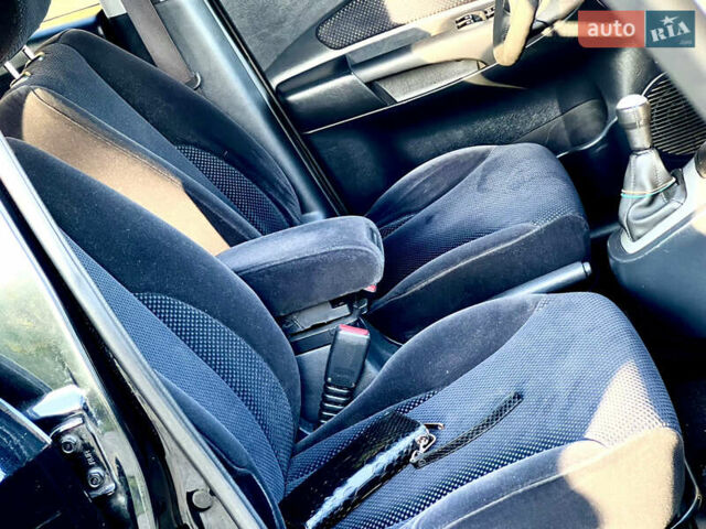 Черный Хендай Туксон, объемом двигателя 2 л и пробегом 167 тыс. км за 7800 $, фото 4 на Automoto.ua