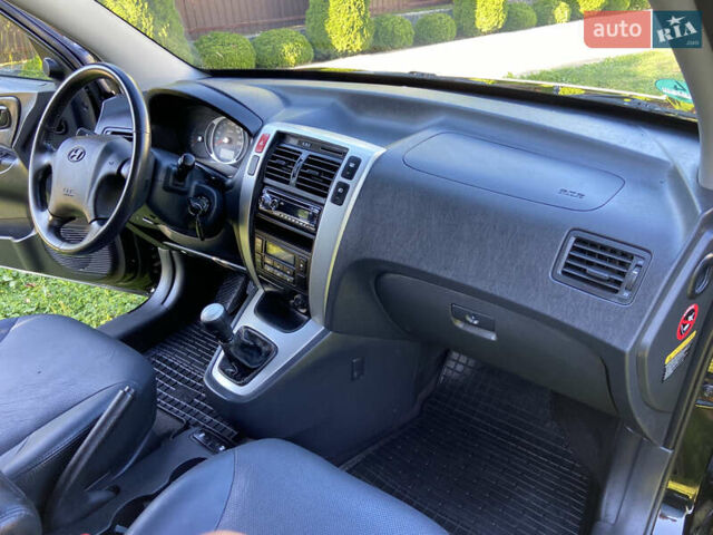 Черный Хендай Туксон, объемом двигателя 1.98 л и пробегом 197 тыс. км за 8000 $, фото 35 на Automoto.ua