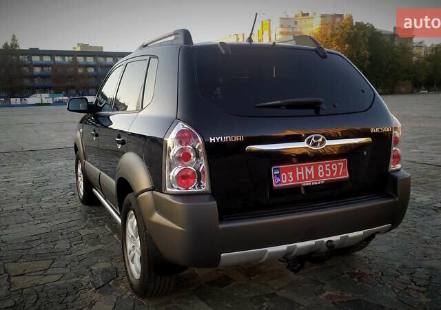 Черный Хендай Туксон, объемом двигателя 2 л и пробегом 230 тыс. км за 8600 $, фото 15 на Automoto.ua