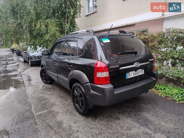 Черный Хендай Туксон, объемом двигателя 1.98 л и пробегом 234 тыс. км за 7800 $, фото 5 на Automoto.ua