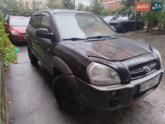 Черный Хендай Туксон, объемом двигателя 1.98 л и пробегом 234 тыс. км за 7800 $, фото 3 на Automoto.ua