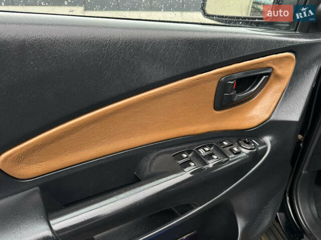 Чорний Хендай Туксон, об'ємом двигуна 2 л та пробігом 230 тис. км за 6850 $, фото 13 на Automoto.ua