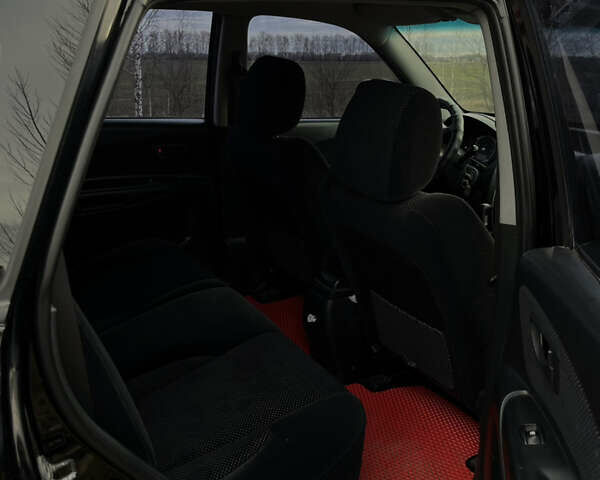 Черный Хендай Туксон, объемом двигателя 2 л и пробегом 300 тыс. км за 7500 $, фото 7 на Automoto.ua