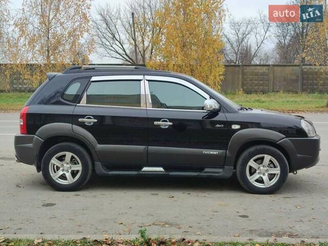 Черный Хендай Туксон, объемом двигателя 2 л и пробегом 270 тыс. км за 6800 $, фото 5 на Automoto.ua