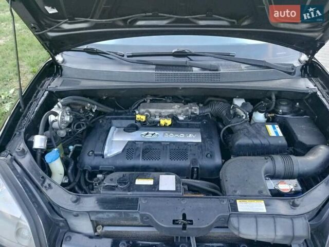 Чорний Хендай Туксон, об'ємом двигуна 1.98 л та пробігом 192 тис. км за 7950 $, фото 46 на Automoto.ua