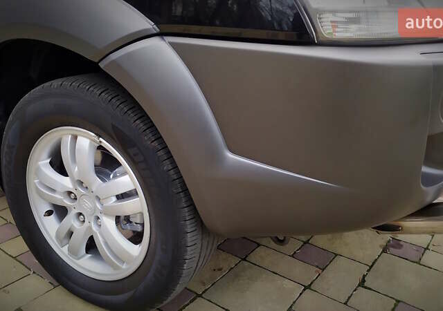 Чорний Хендай Туксон, об'ємом двигуна 2 л та пробігом 229 тис. км за 8600 $, фото 64 на Automoto.ua