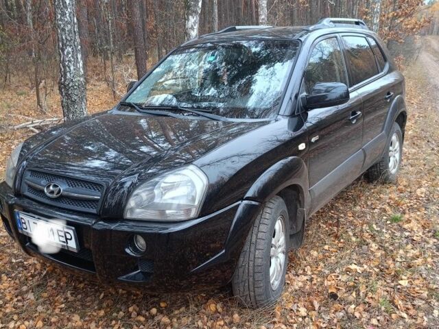 Черный Хендай Туксон, объемом двигателя 2 л и пробегом 240 тыс. км за 8800 $, фото 1 на Automoto.ua