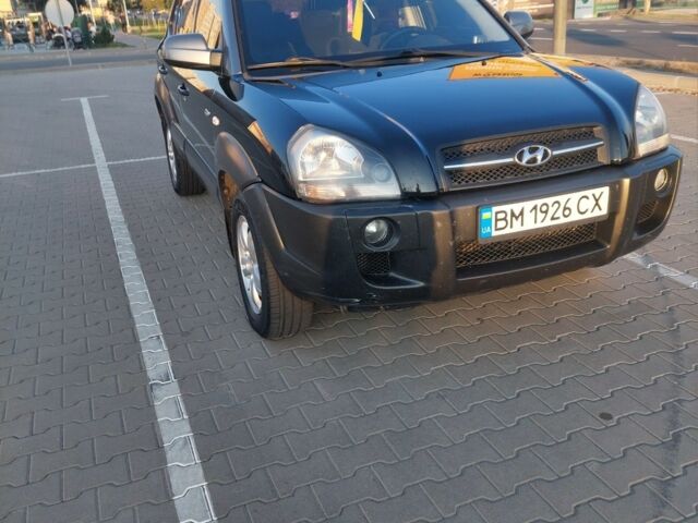 Черный Хендай Туксон, объемом двигателя 2 л и пробегом 289 тыс. км за 6600 $, фото 4 на Automoto.ua