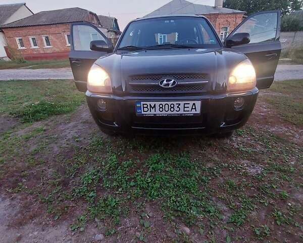 Черный Хендай Туксон, объемом двигателя 1.98 л и пробегом 200 тыс. км за 7100 $, фото 5 на Automoto.ua
