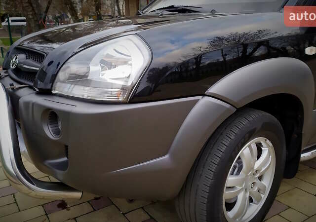 Чорний Хендай Туксон, об'ємом двигуна 2 л та пробігом 229 тис. км за 8600 $, фото 57 на Automoto.ua