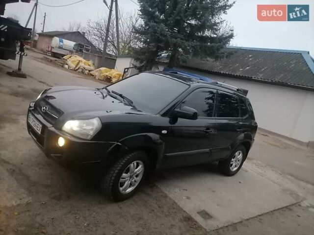 Черный Хендай Туксон, объемом двигателя 1.98 л и пробегом 238 тыс. км за 8400 $, фото 3 на Automoto.ua