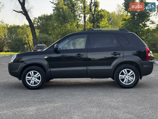 Черный Хендай Туксон, объемом двигателя 2 л и пробегом 239 тыс. км за 7850 $, фото 7 на Automoto.ua