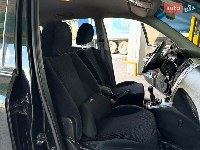 Черный Хендай Туксон, объемом двигателя 2 л и пробегом 310 тыс. км за 6499 $, фото 11 на Automoto.ua