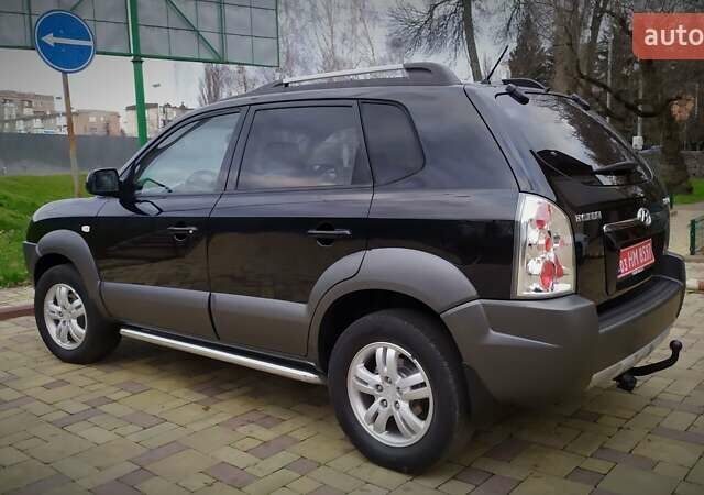 Чорний Хендай Туксон, об'ємом двигуна 2 л та пробігом 229 тис. км за 8600 $, фото 49 на Automoto.ua