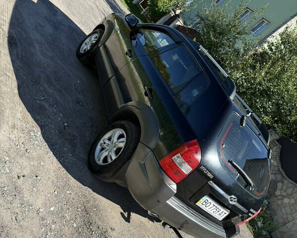 Черный Хендай Туксон, объемом двигателя 2 л и пробегом 294 тыс. км за 7500 $, фото 6 на Automoto.ua