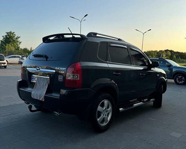 Черный Хендай Туксон, объемом двигателя 1.99 л и пробегом 231 тыс. км за 8500 $, фото 11 на Automoto.ua