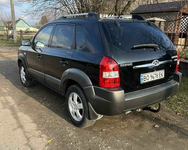 Черный Хендай Туксон, объемом двигателя 1.99 л и пробегом 302 тыс. км за 6900 $, фото 5 на Automoto.ua