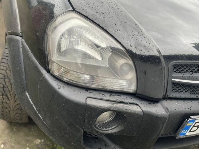 Чорний Хендай Туксон, об'ємом двигуна 2 л та пробігом 230 тис. км за 5999 $, фото 2 на Automoto.ua