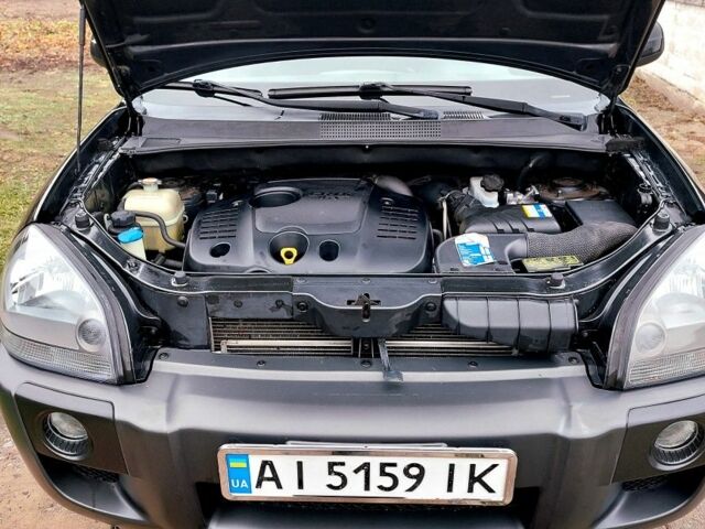 Черный Хендай Туксон, объемом двигателя 2 л и пробегом 272 тыс. км за 7500 $, фото 17 на Automoto.ua