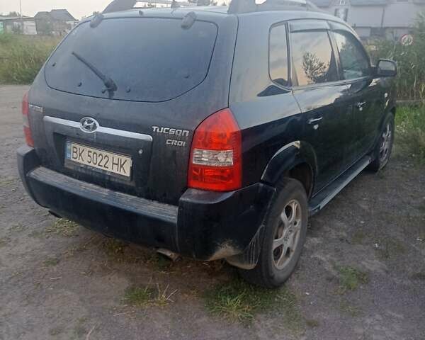 Черный Хендай Туксон, объемом двигателя 1.99 л и пробегом 239 тыс. км за 7700 $, фото 3 на Automoto.ua