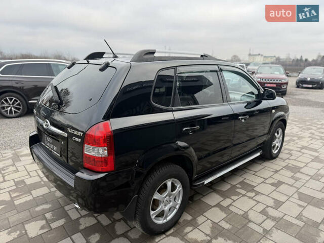Чорний Хендай Туксон, об'ємом двигуна 2 л та пробігом 240 тис. км за 6888 $, фото 7 на Automoto.ua