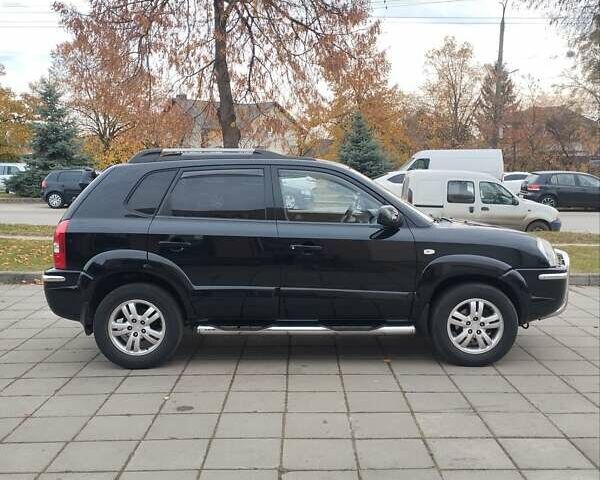 Черный Хендай Туксон, объемом двигателя 1.98 л и пробегом 214 тыс. км за 7700 $, фото 7 на Automoto.ua