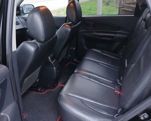 Черный Хендай Туксон, объемом двигателя 2 л и пробегом 230 тыс. км за 8000 $, фото 10 на Automoto.ua