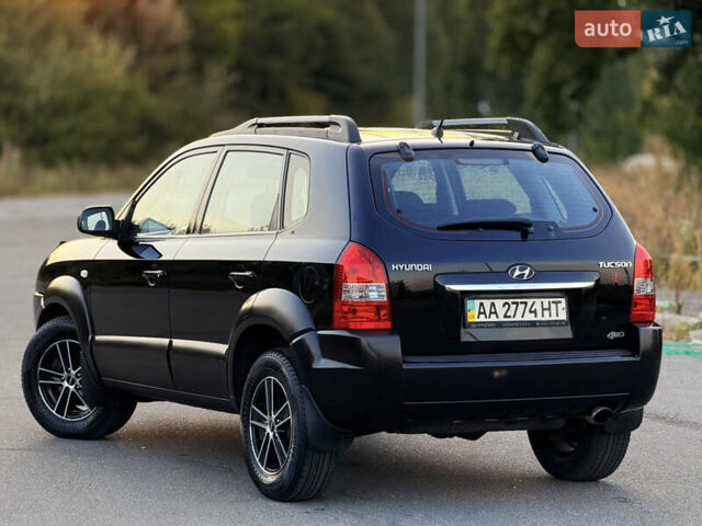 Черный Хендай Туксон, объемом двигателя 2 л и пробегом 250 тыс. км за 7600 $, фото 11 на Automoto.ua