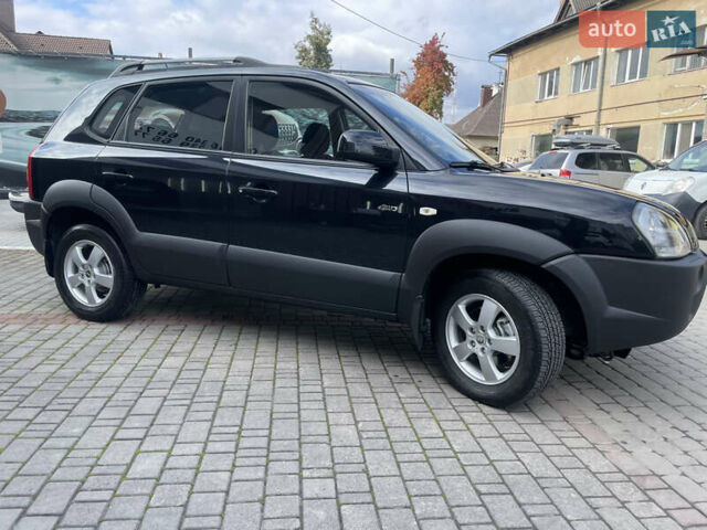 Черный Хендай Туксон, объемом двигателя 1.98 л и пробегом 177 тыс. км за 7600 $, фото 5 на Automoto.ua
