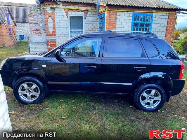 Черный Хендай Туксон, объемом двигателя 2 л и пробегом 187 тыс. км за 7900 $, фото 2 на Automoto.ua
