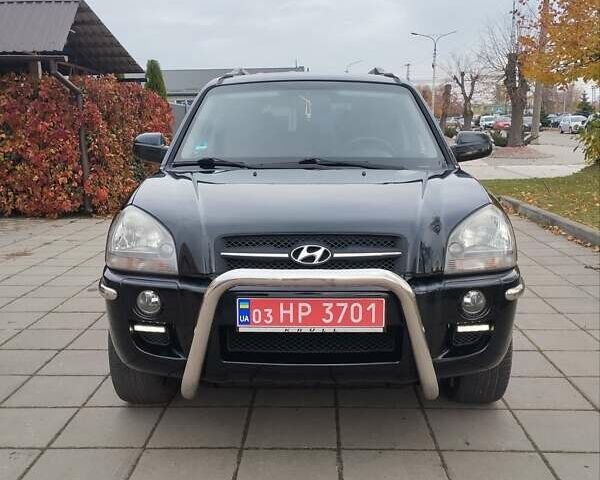 Черный Хендай Туксон, объемом двигателя 1.98 л и пробегом 214 тыс. км за 7700 $, фото 5 на Automoto.ua