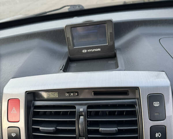 Черный Хендай Туксон, объемом двигателя 2 л и пробегом 210 тыс. км за 7850 $, фото 31 на Automoto.ua